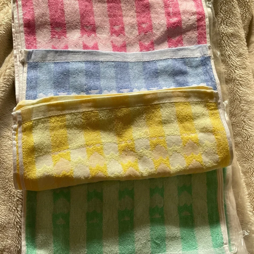 Beautiful NWOT hand towel 13”X30”, set of 12, 3 pink, blue, yellow, and green!